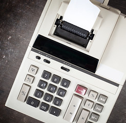 Image showing Closeup of an old dirty calculator 