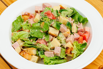 Image showing Salad with cheese, ham and fresh vegetables