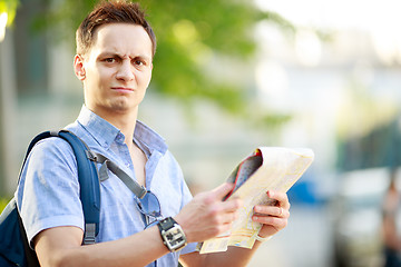 Image showing Young man with map