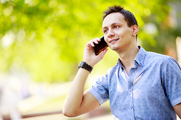 Image showing handsome young man talking on the cell phone