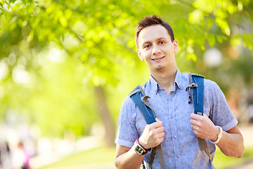 Image showing bright picture of travelling student with backpack and book