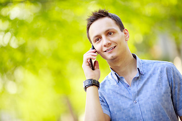 Image showing handsome young man talking on the cell phone