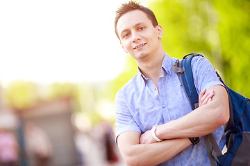 Image showing bright picture of travelling student with backpack and book