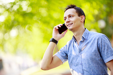 Image showing handsome young man talking on the cell phone