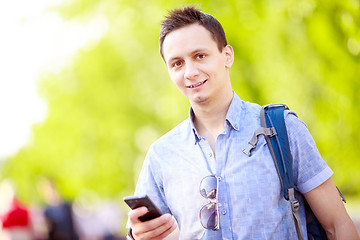 Image showing Close up portrait of a young man with phone