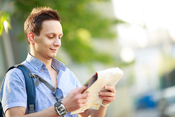 Image showing Young man with map