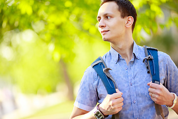 Image showing bright picture of travelling student with backpack and book