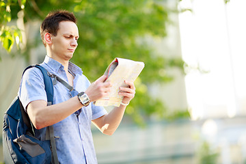 Image showing Young man with map