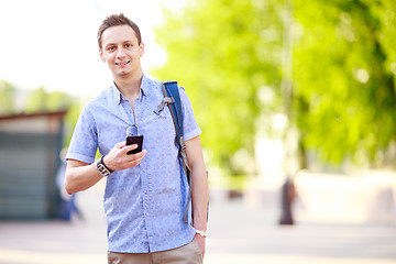 Image showing Close up portrait of a young man with phone