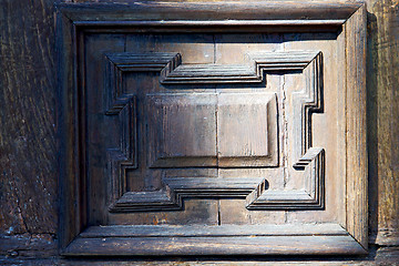 Image showing   blur   abstract   rusty brass brown knocker in a  door curch  