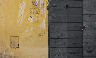 Image showing Scraped wall and a wooden door