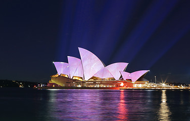 Image showing Light beams project soft pastel colours onto Sydney Opera House