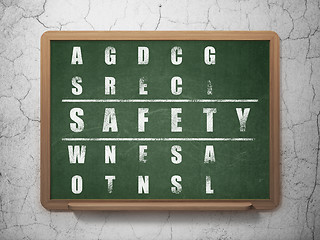 Image showing Safety concept: word Safety in solving Crossword Puzzle