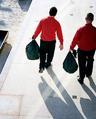 Image showing Taking out the garbage