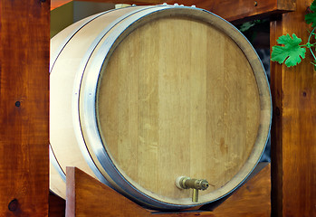 Image showing Wooden oak barrel wine,  with metal crane. .