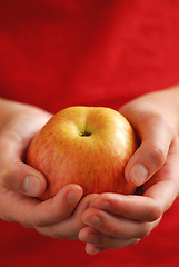 Image showing Apple in hands