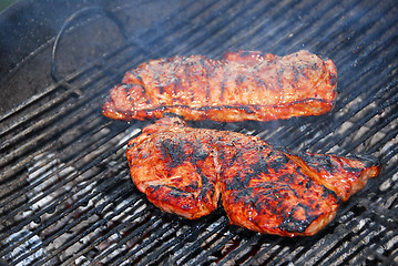 Image showing Steaks on barbeque