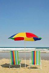 Image showing Beach chairs and umbrella