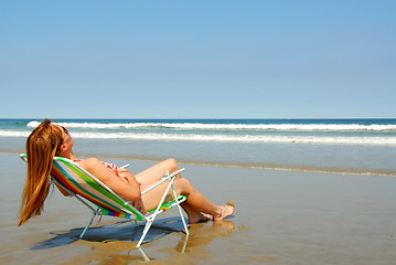 Image showing Woman relaxing on beach