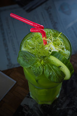 Image showing tropical green cocktail with lemon and fresh mint