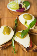 Image showing Bruschetta with tomato, mozarella and olive