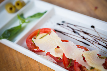 Image showing Fresh tomatoes, basil, garlic and parmesan cheese