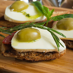 Image showing Bruschetta with tomato, mozarella and olive