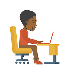 Image showing African sitting infront his computer.