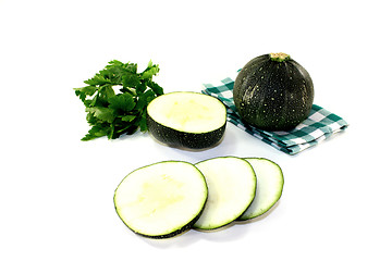 Image showing rotund raw zucchini on a napkin