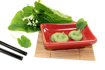 Image showing Wasabi with Chopsticks, leaves and blossoms