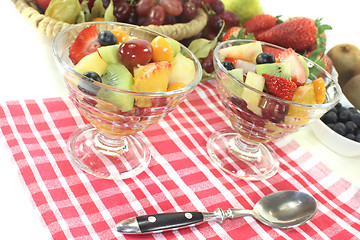 Image showing Fruit salad in a bowl on checkered napkin