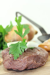 Image showing Ostrich steak with onions