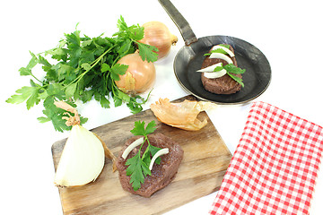 Image showing Ostrich steak with parsley