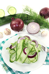 Image showing Cucumber salad with red onions