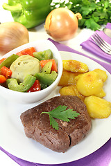 Image showing Ostrich steak with crispy baked potatoes