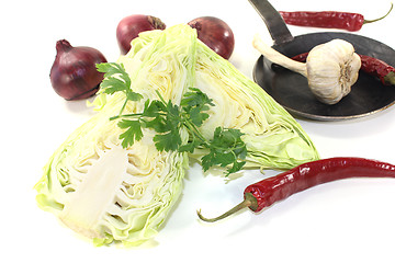 Image showing sweetheart cabbage with onions in a pan