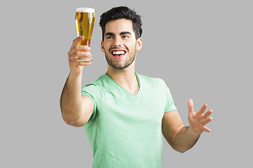 Image showing Young man drinking beer