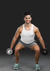 Image showing Athletic man lifting weights