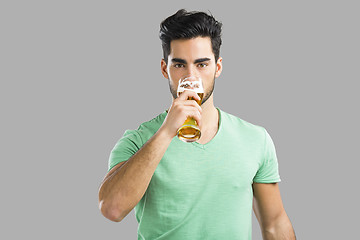 Image showing Young man drinking beer