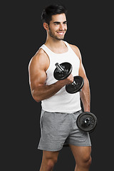 Image showing Athletic man lifting weights