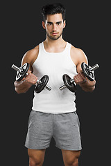 Image showing Athletic man lifting weights