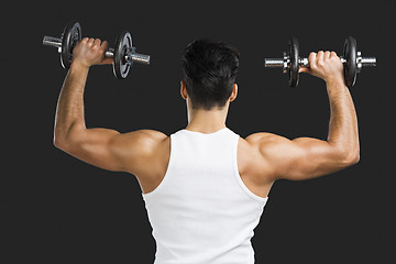 Image showing Athletic man lifting weights