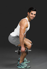 Image showing Athletic man lifting weights