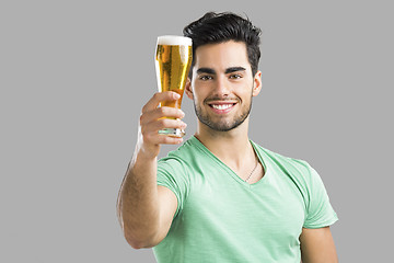 Image showing Young man drinking beer