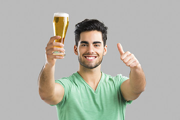 Image showing Young man drinking beer