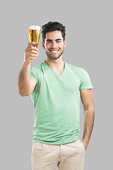 Image showing Young man drinking beer