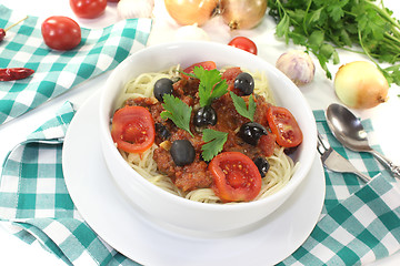 Image showing Spaghetti alla puttanesca with tomatoes