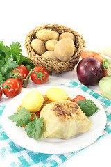 Image showing Stuffed cabbage with potatoes and tomato