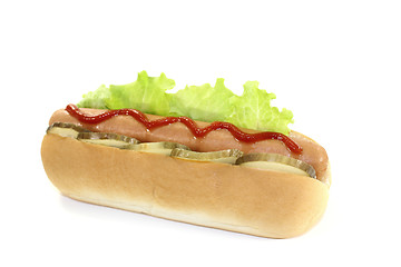 Image showing Hot dog with pickle and ketchup