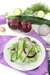 Image showing Cucumber salad with onions and garlic flower